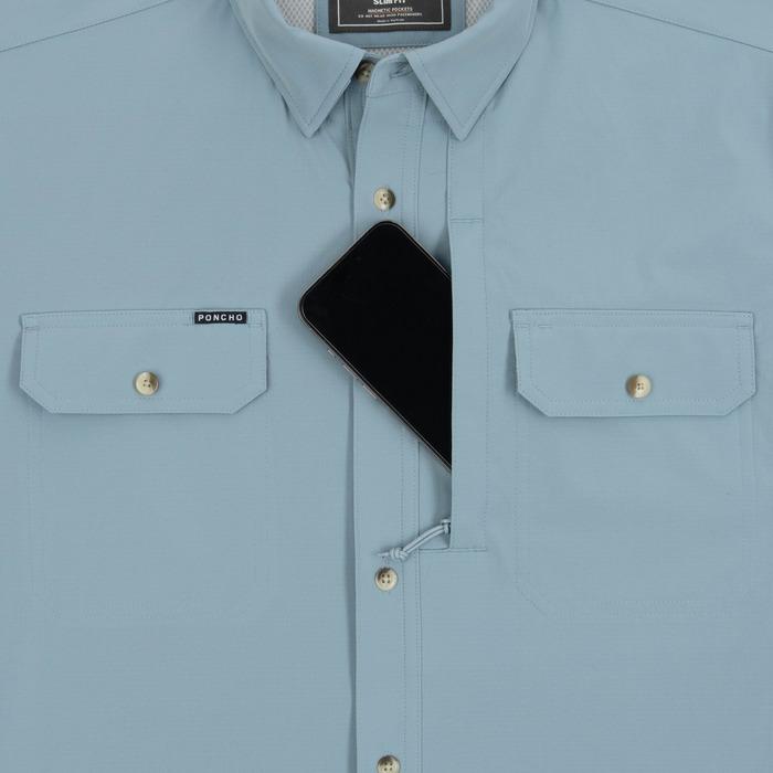 phone in chest zipper pocket of shirt