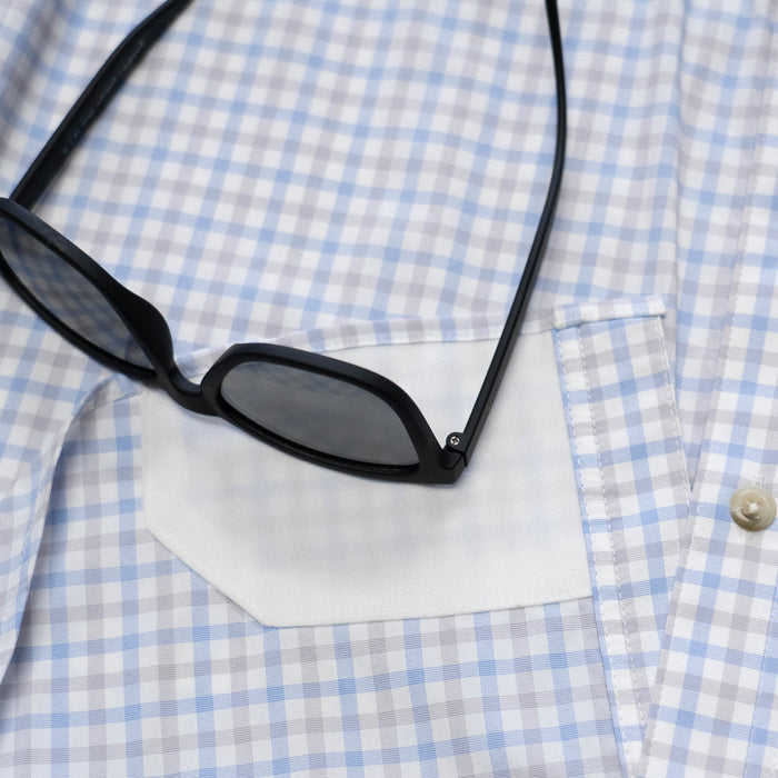Closeup of sunglasses with lens cleaner on shirt
