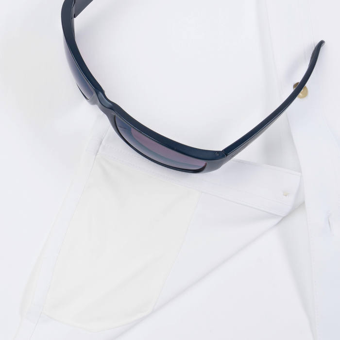 Closeup of sunglasses with lens cleaner on shirt