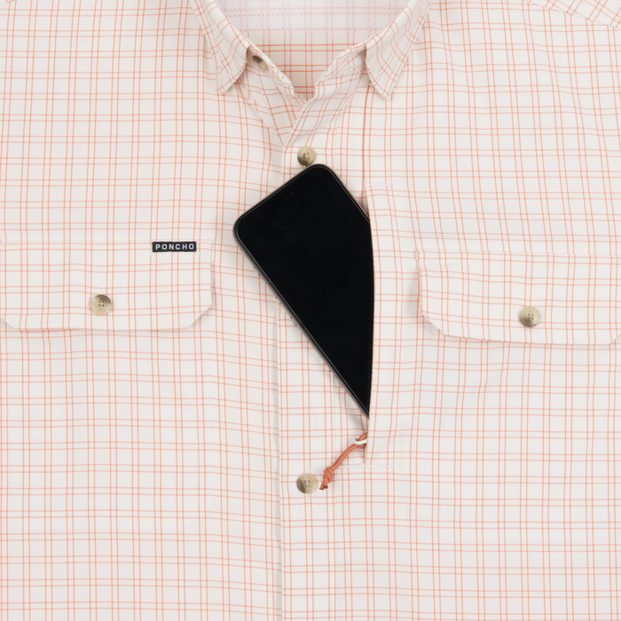 phone in chest zipper pocket of shirt