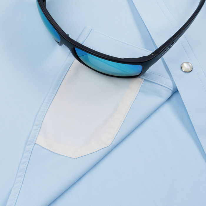 Closeup of sunglasses with lens cleaner on shirt