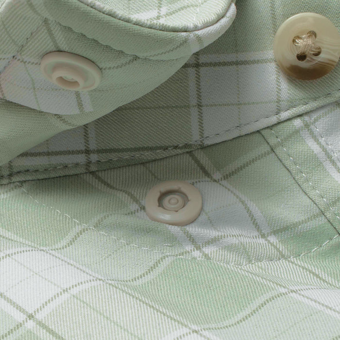 Close-up of light green plaid fabric and buttons on The Sapelo outdoor shirt