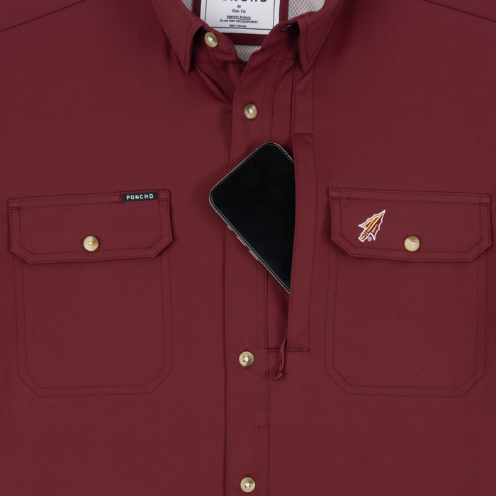 Phone in chest zipper pocket of shirt