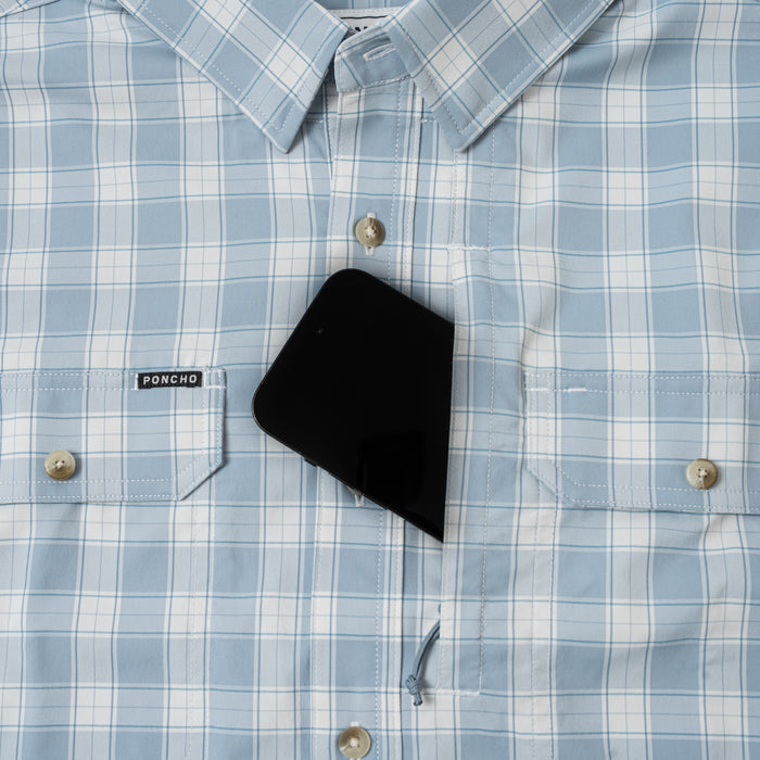 phone in chest zipper pocket of shirt