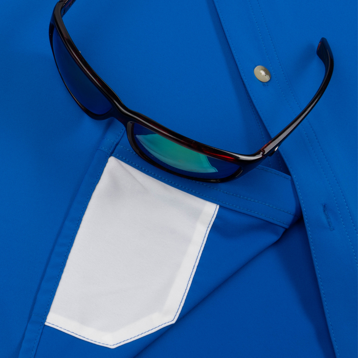 Closeup of sunglasses with lens cleaner on shirt