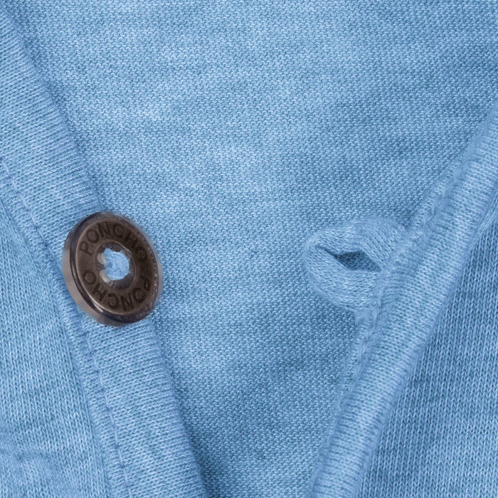 Close-up of blue breathable fabric and button on The Thousand Lakes outdoor shirt