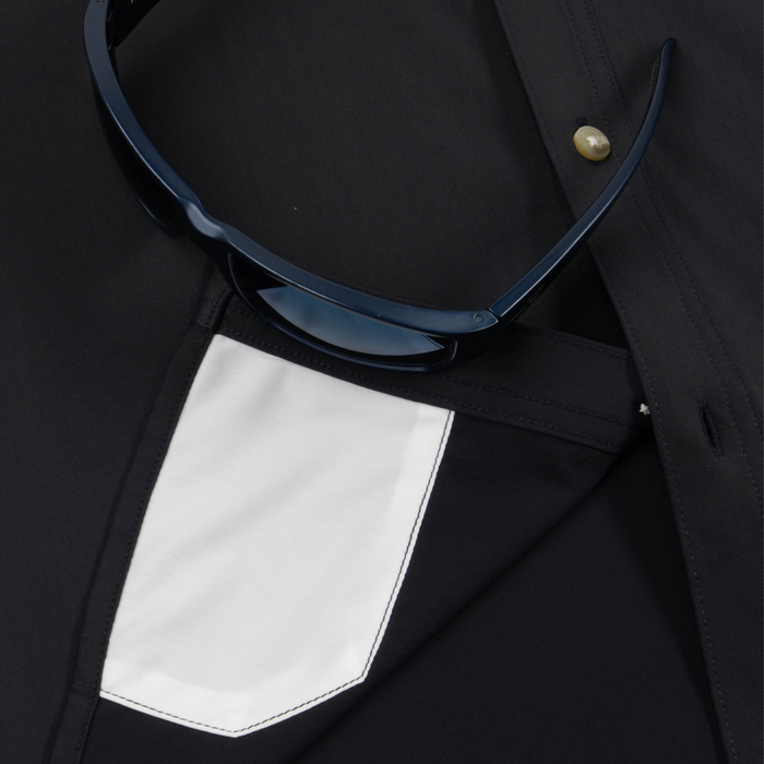 Closeup of sunglasses with lens cleaner on shirt