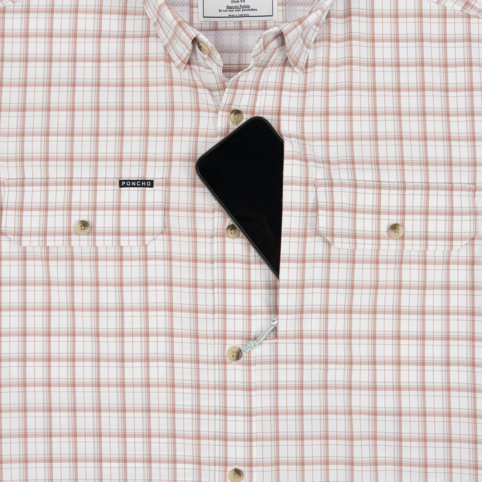 Phone in chest zipper pocket of shirt