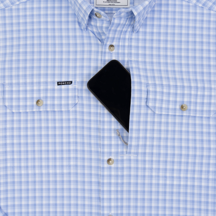 Phone in chest zipper pocket of shirt