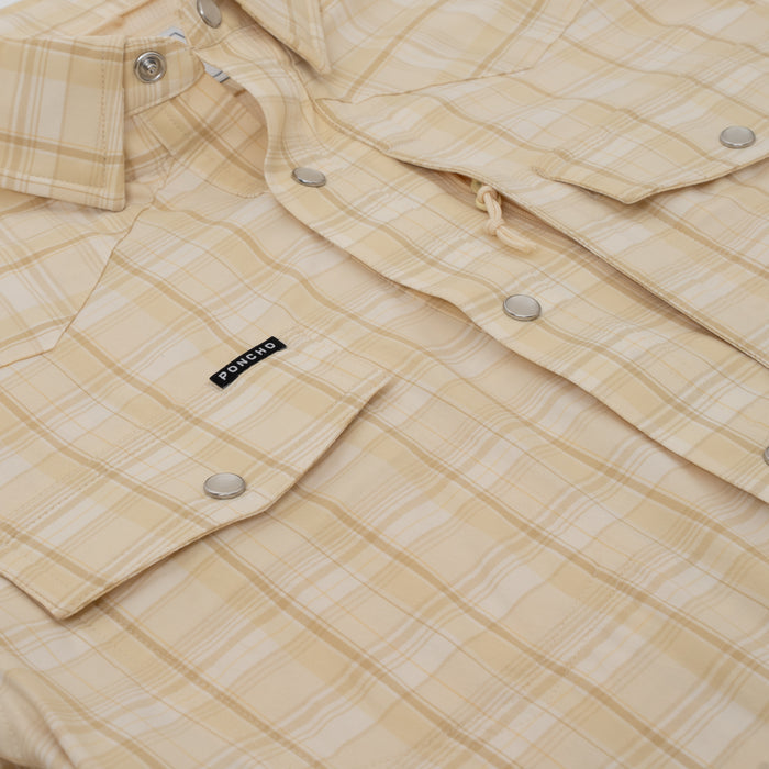 Close-up of The Yellowbelly comfortable outdoor shirt in pale yellow plaid with snap buttons and chest pockets