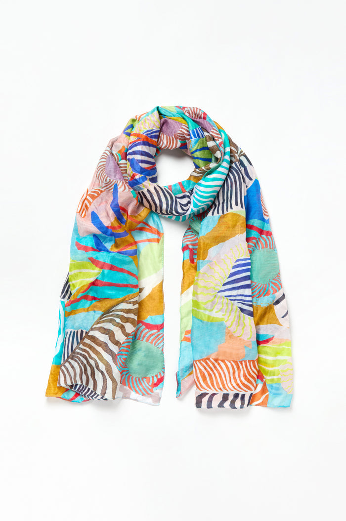 The Tropical Orchid Fantasy Silk Scarf is a lightweight silk accessory with a vibrant abstract pattern in blue, orange, green, yellow, and brown on white—ideal for adding a tropical flair to any outfit.
