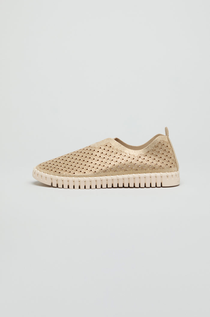 A beige Tulip Glitter Slip on Shoe by Ilse Jacobsen, featuring a perforated woven design and textured sole, is displayed in profile against a plain light background.